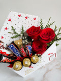 Sobre con rosas y chocolates