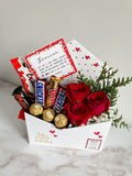 Sobre con rosas y chocolates