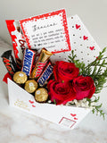 Sobre con rosas y chocolates