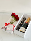 Caja sorpresa botella de moet chandon, fresas con chocolate y rosas